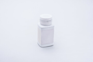 white plastic bottle medicine