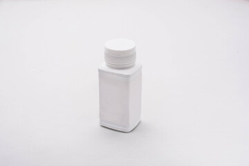 white plastic bottle on white