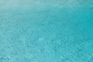 Sea water background. Blue sea surface with ripples. Rippled texture of ocean surface