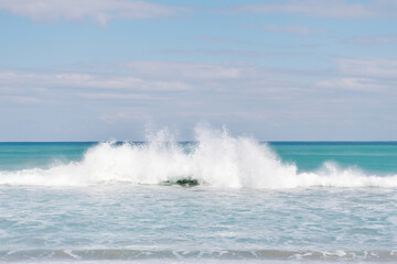 water splash seascape with blue sky over sea or ocean water, nature