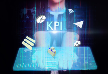 Business, Technology, Internet and network concept. Young businessman working on a virtual screen of the future and sees the inscription: KPI