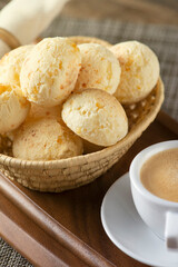 CHEESE BREAD WITH ESPRESSO COFFEE ON A WOODEN TABLE