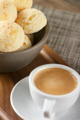 CHEESE BREAD WITH ESPRESSO COFFEE ON A WOODEN TABLE