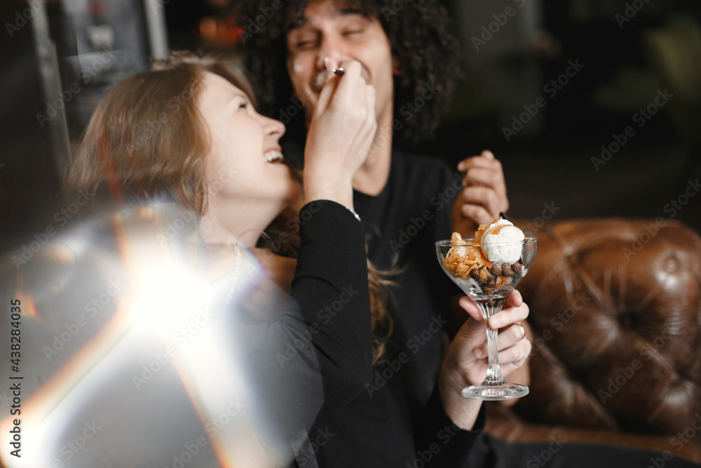 Poster mixed couple spenting time together in a cafe