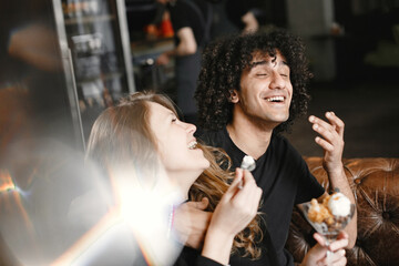 Mixed couple spenting time together in a cafe
