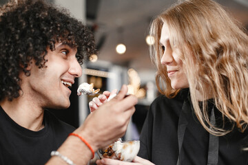 Mixed couple spenting time together in a cafe