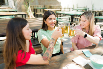 Beautiful women meeting for drinks at the bar
