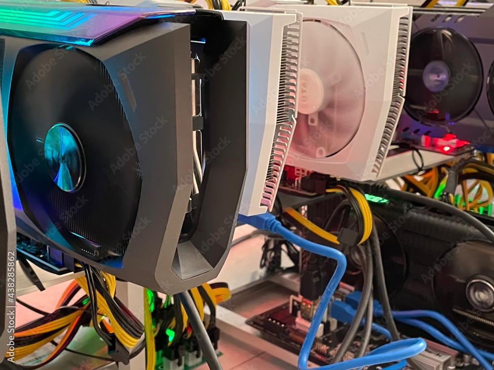 Poster row of bitcoin miners set up on the wired shelfs. device for mining crypto currency. mining cryptocu