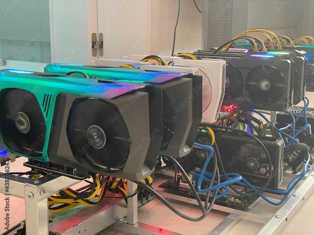 Poster row of bitcoin miners set up on the wired shelfs. device for mining crypto currency. mining cryptocu