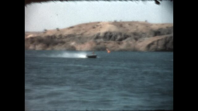 Speedboat Racer at Parker 1967

Headgate Rock Dam is the backdrop as a speedboat races in the Parker Nine Hour enduro races on Lake Moovalya, part of the Colorado River, in Parker, Arizona. 1967. 