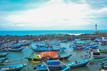Fototapeta na wymiar Aerial view of beautiful traditional fishing boat Indonesia. sea view filled with fishing boats