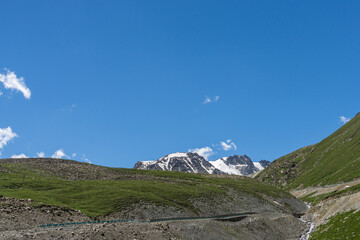Mountains and grasslands along G217 highway in Xinjiang, China in summer