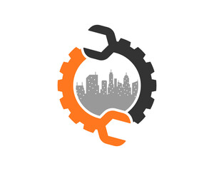 Circle gear and wrench with city building inside