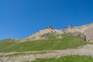 Mountains and grasslands along G217 highway in Xinjiang, China in summer