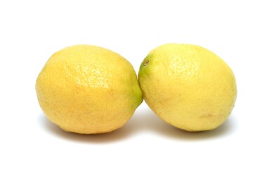2 ripe yellow lemons on a white background
