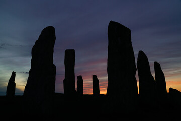 Silhoutte of the callanish stones at sunset, located on the isle of Lewis, Outer Hebrides, Scotland.