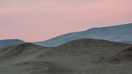Fototapeta na wymiar pink sunset over Peruvian pacific desert