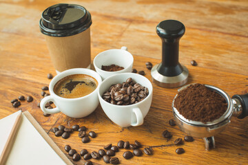 Coffee cup and beans on old kitchen table