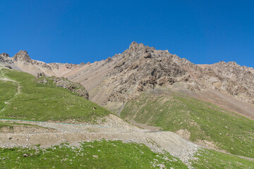 Mountains and grasslands along G217 highway in Xinjiang, China in summer