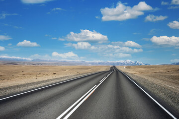 Beautiful view along Chuysky tract, Altai Republic, Russia, empty road, mountains and blue cloudy sky