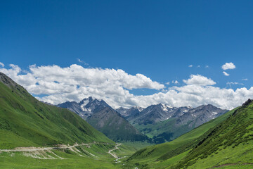 Fototapeta premium Mountains and grasslands along G217 highway in Xinjiang, China in summer