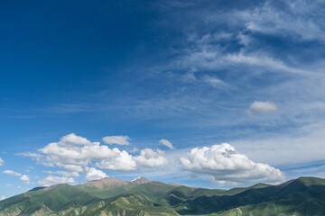 Mountains and grasslands along G217 highway in Xinjiang, China in summer