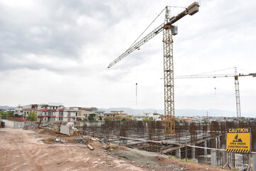 Fototapeta na wymiar Construction site with cranes wide angle shot 