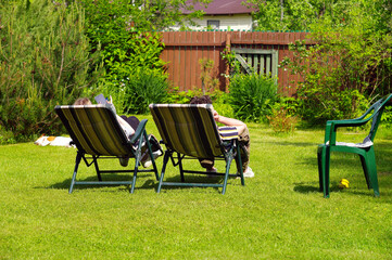 people sunbathing in a garden