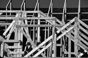 Wood framing of  a new house under construction in abstract form in the Southwest part of the United States