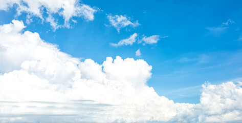 Summer blue sky with white cloud as background on a sunny day. Abstract cloud on blue sky background. Panorama view of the sky for background and wallpaper.