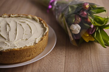 Banana homemade cream pie and a bouquet of flowers