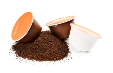 Coffee capsules with powder on white background