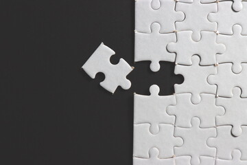 Jigsaw puzzle with missing piece. Missing puzzle pieces. Concept image of unfinished task. Completing final task, missing jigsaw puzzle pieces and business concept with a puzzle piece missing. black