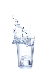 Glass of water with splash on white background