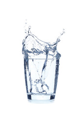 Fototapeta na wymiar Glass of water with splash on white background
