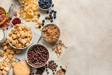 Different cereals and berries on light background