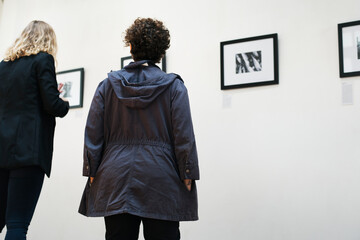 People attending an art exhibition