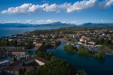 Foto op Canvas Aerial view of a tourist town in Italy. Italian resorts on Lake Garda. The city of peschiera del garda at sunset. Aerial panorama of the city of Peschiera del Garda on Lake Garda, Italy. © Berg