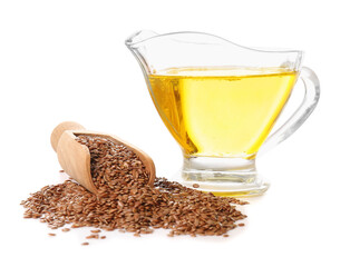 Gravy boat of flax oil and seeds on white background