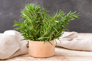 Box with fresh rosemary on dark background