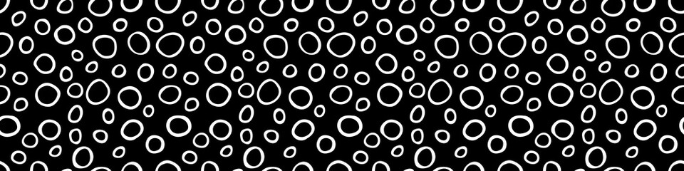 Spotty abstract vector seamless pattern. Random rings, dots, circles, spots, stains, bubbles, stones. Design for fabric, funny cute print. Irregular random texture. Repetitive graphic background