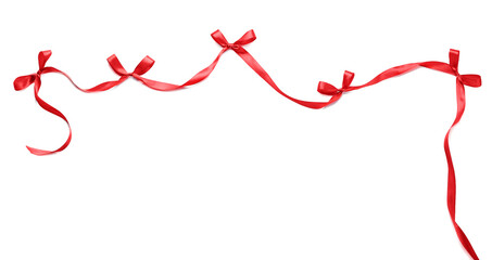 Bows made of red ribbon on white background