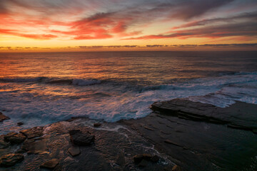 Fototapeta premium Aerial Sunrise Seascape at Rocky Inlet with colourful high cloud