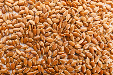 Many flax seeds as background