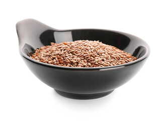 Bowl with flax seeds on white background