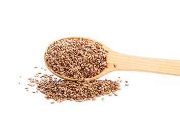 Spoon with flax seeds on white background