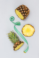 Pineapple cut into pieces and measuring tape