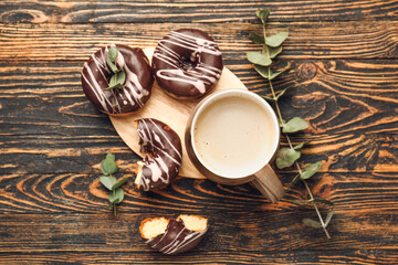 Composition with cup of freshly brewed coffee on wooden table