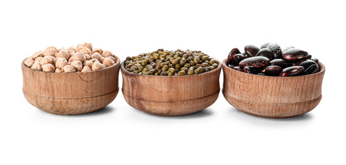 Bowls with different legumes on white background