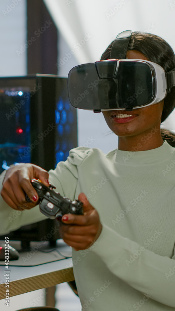 Poster winner player holding joystick playing videogame in gaming room using virtual reality. professional 